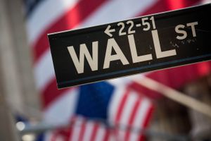 A Wall Street sign is displayed in front of the New York Stock Exchange (NYSE) in New York, on Nov. 11, 2016. Photo: Michael Nagle.