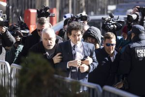 Sam Bankman-Fried, co-founder of FTX Cryptocurrency Derivatives Exchange, arrives at court in New York, U.S., on Thursday, March 30, 2023. Bankman-Fried faces a total of 13 counts ranging from conspiracy to commit wire fraud to conspiracy to violate the anti-bribery provisions of the Foreign Corrupt Practices Act, and faces more than 155 years in prison if convicted of all of them - although any sentence is likely to be much lower if he is found guilty. Bloomberg photo by Angus Mordant