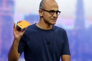 Microsoft CEO Satya Nadella holds up the Nokia Lumia 930 phone that uses Windows 8.1 during the keynote address of the Build Conference Wednesday, April 2, 2014, in San Francisco. Microsoft kicked off its annual conference for software developers, with new updates to the Windows 8 operating system and upcoming features for Windows Phone and Xbox. 
