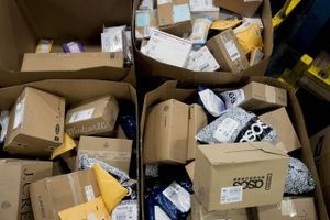 Packages at USPS processing center in Virginia. Bloomberg photo by Andrew Harrer