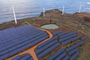 Wind turbines beyond an array of solar panels on the hillside in the Canical district of Madeira, Portugal, on Thursday, Feb. 9, 2023. Renewables are now among the cheapest forms of electricity, especially after an energy crunch and the Ukraine war bolstered gas, oil and coal. Bloomberg photo by Zed Jameson