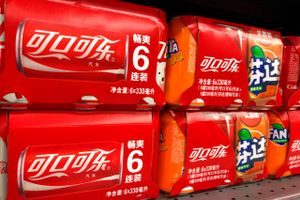 Tins of Coca-Cola coke are for sale at a supermarket in Shanghai, China, 16 December 2018. Ask an economist when the Coca-Cola Co.'s syrupy drinks first washed up on Chinese shores, and they will likely point you to the Deng Xiaoping-era embrace of market economics four decades ago. The company entered the country in December 1978, just weeks before China and the U.S. established full diplomatic relations. But that was the quintessentially American beverage giant's second coming. Coca-Cola began selling its sodas in China in 1927. It was booted out in 1949 when Mao Zedong, the leader of the young People's Republic, deemed Coke too bourgeois for Communist China. Even in the reform era, the company was treated cautiously. For its first few years in China, Coke was sold primarily in closely watched import stores catering mainly to foreigners. When an on-the-street Coke promotion was felt to have crossed a red line, sales of the soda were banned outright for a year. (Imaginechina via AP Images)