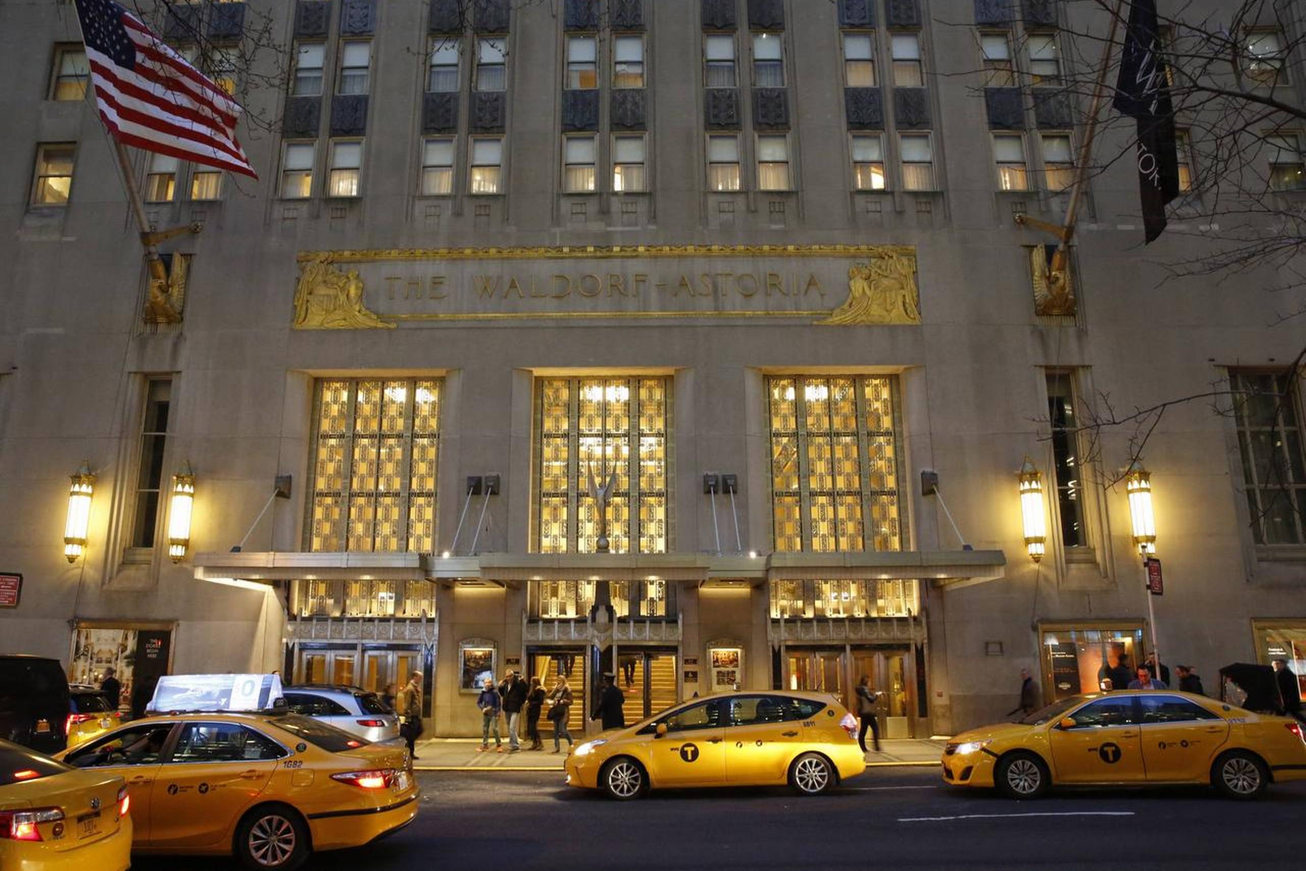 Taxis pull up in front of the renowned Waldorf Astoria hotel in New York on Tuesday, Feb. 28, 2017. The hotel, purchased by the Anbang Insurance Group, a Chinese company, is closing Wednesday for two to three years for renovation. Exact details of the renovation haven't been released, but its conversion into a hybrid of private residences and a smaller hotel follows a model set by another landmark New York City hotel, The Plaza. (AP Photo/Kathy Willens)