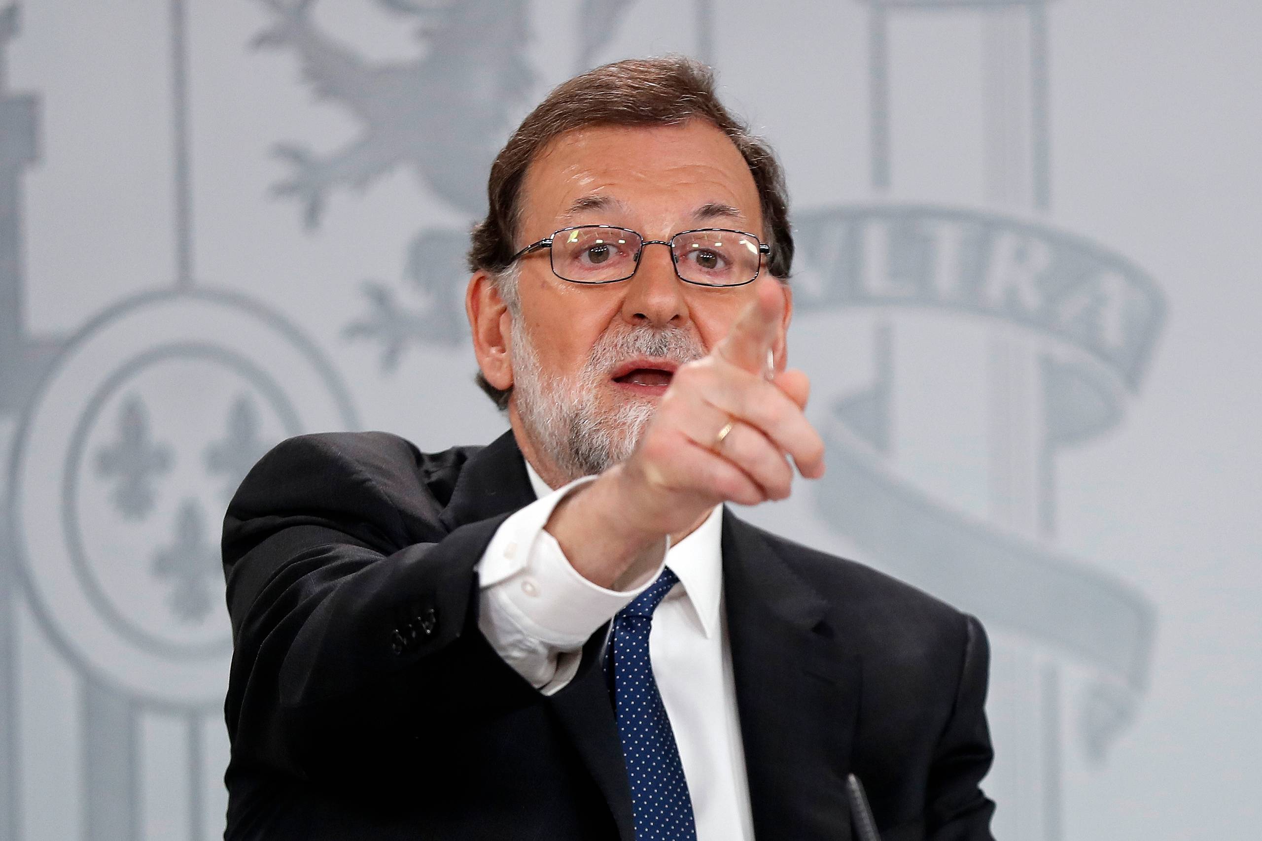 Spaniens konservative premierminister Mariano Rajoy skal fredag forsøge at overleve en mistillidsafstemning i parlamentet i Madrid. Foto: AP