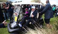 Den tidligere amerikanske præsident har flere store golfbaner og -resorter i Skotland. Her ses han med sit barnebarn Kai ved anlægget ved Balmedie nær Aberdeen i Skotland. Foto: Andrew Milligan/AP