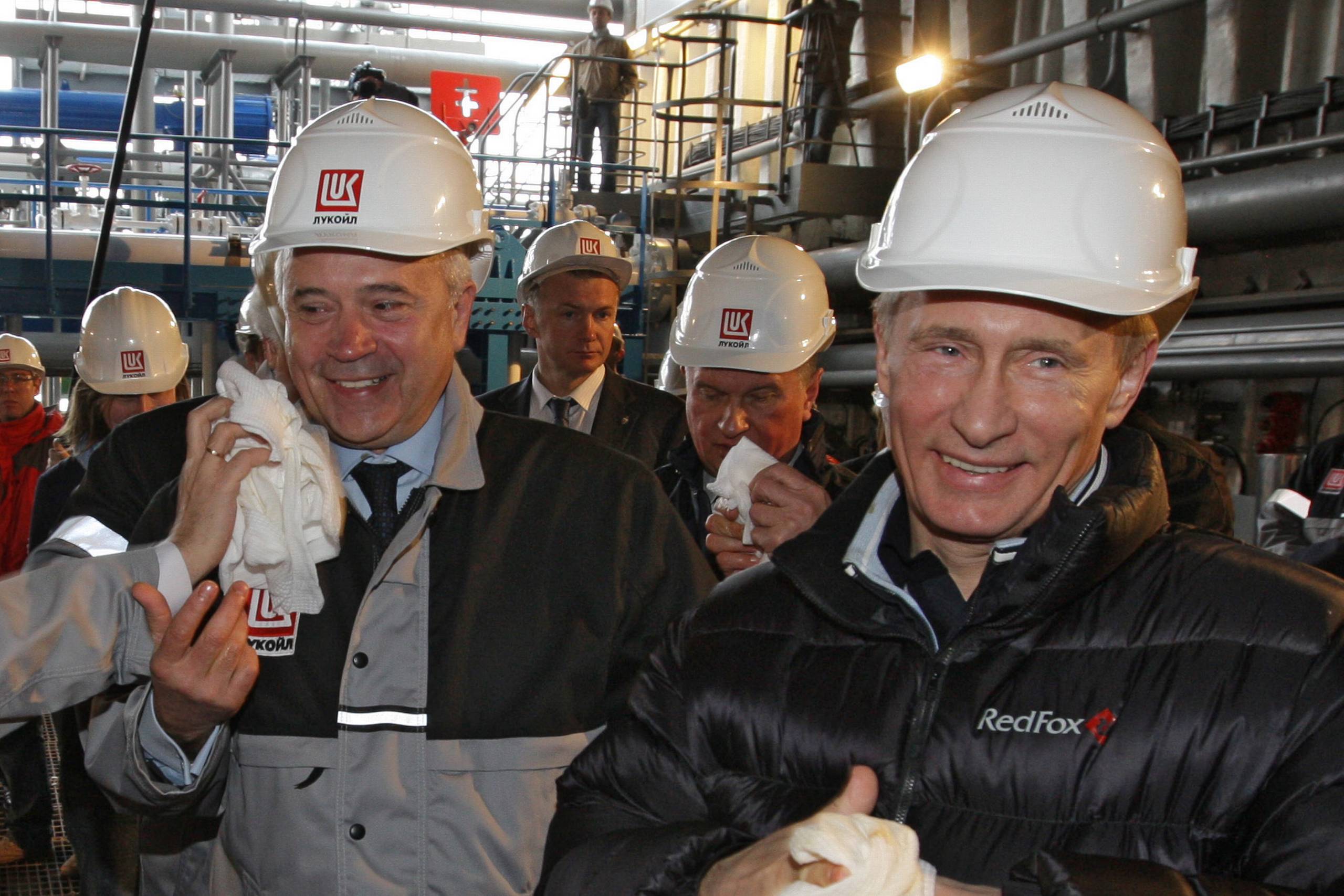  In this Wednesday, April 28, 2010, photo Russian Prime Minister Vladimir Putin, right, visits a Lukoil oil platform in the Caspian Sea, about about 1280 kilometers (800 miles) south of Moscow, Russia. At left is Lukoils CEO Vagit Alekperov. (AP Photo/RIA-Novosti, Alexei Druzhinin, Pool)
