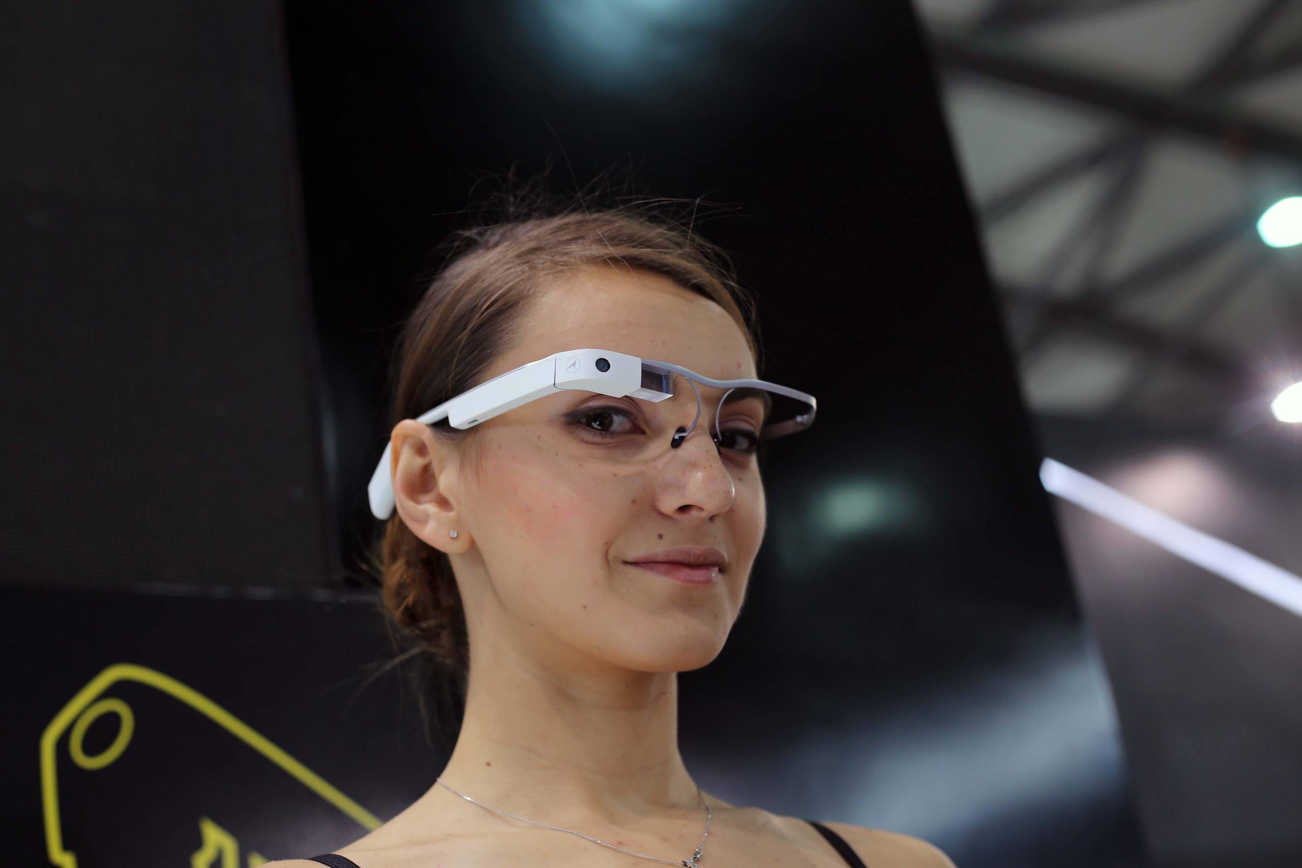 A model displays a pair of smart glasses during the International Consumer Electronics Show Asia (International CES Asia) in Shanghai, China, 26 May 2015.