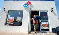 Domino's Pizza er verdens største pizzakæde med over 10.000 restauranter.  Foto: Nikki Fox/Daily News-Record via AP.