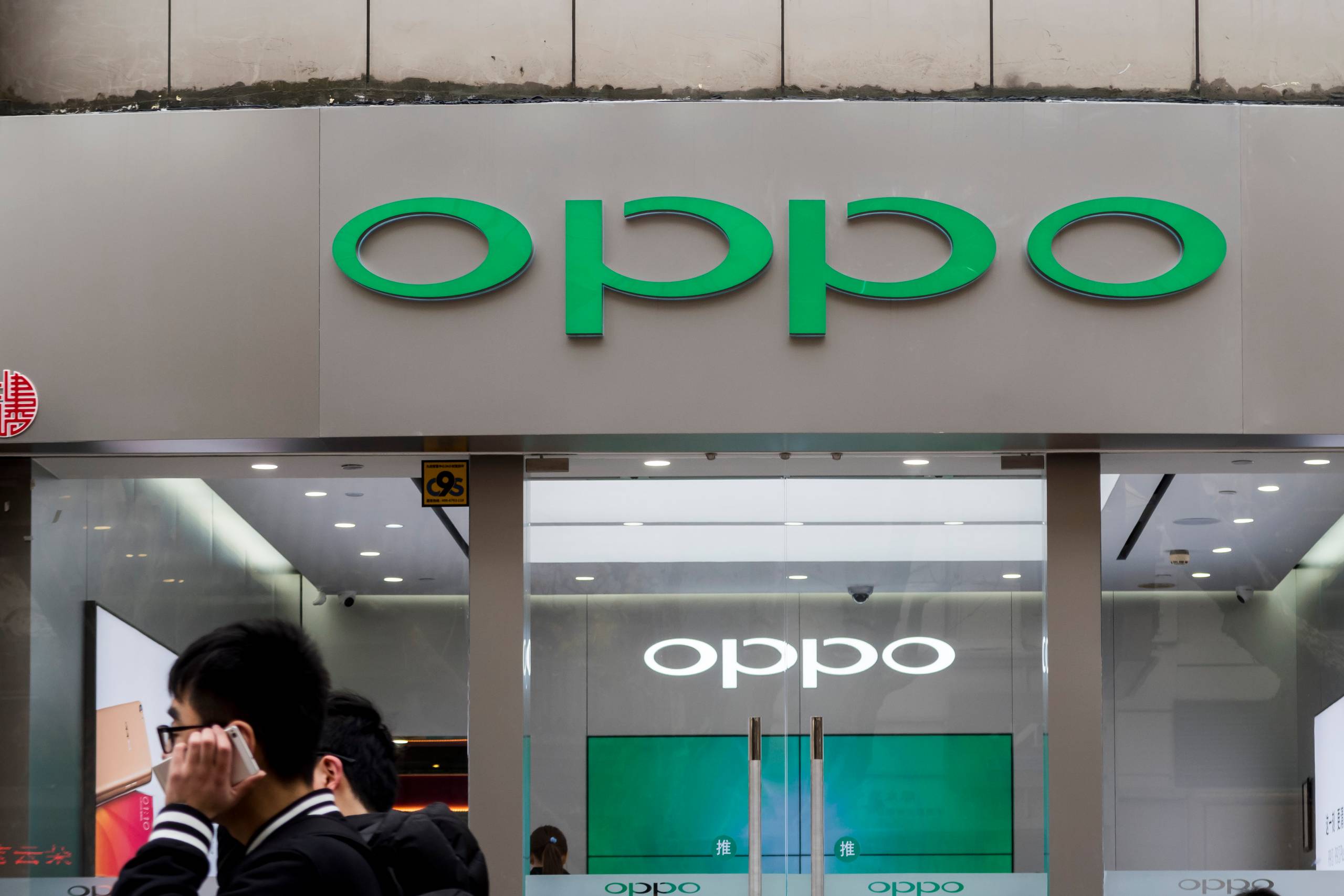 OPPO er en af Kinas hjemmebyggede smartphone-giganter. Apple er presset på markedet. Foto: Imaginechina via AP Images