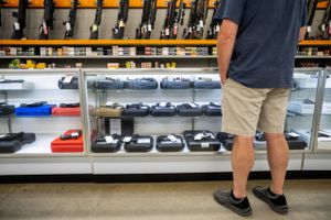 A customer views handguns for sale at Knob Creek Gun Range in West Point, Kentucky, U.S., on Thursday, July 22, 2021. Firearm sales have reached a near-record pace of well over 1 million a month, according to Small Arms Analytics & Forecasting. Bloomberg photo by Jon Cherry
